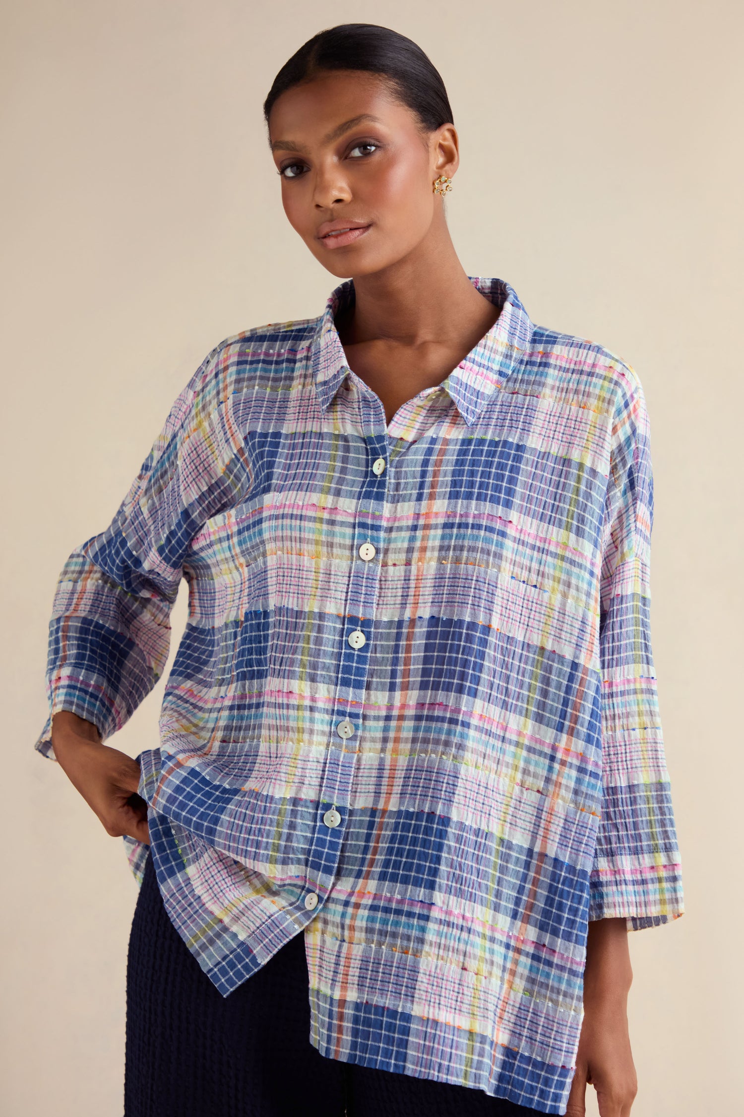 A woman wears the Crinkle Check Jacquard Shirt—a loose-fitting, cotton-rich plaid button-up with long sleeves—and dark pants, standing against a neutral background.