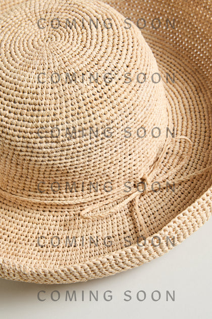 The Handwoven Raffia Tie Hat is displayed against a neutral background with "COMING SOON" and "TON1158" overlaid multiple times on the image.