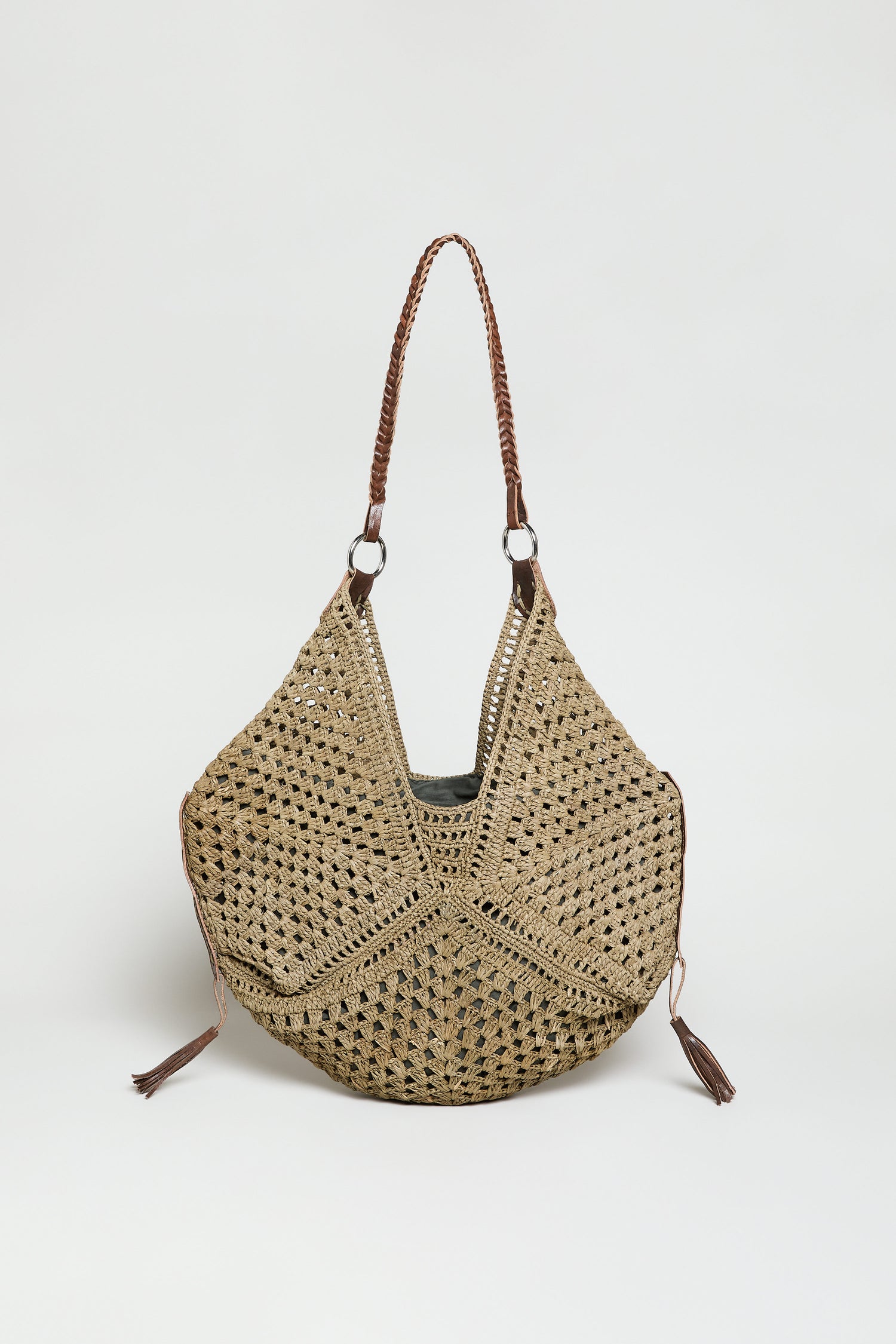 The Handwoven Raffia Tassel Detail Handbag features brown braided shoulder straps and tassel accents, showcased on a white background—an elegant artisanal accessory for any occasion.
