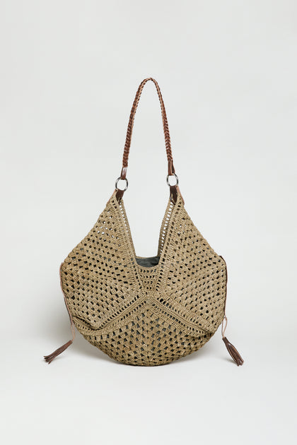 The Handwoven Raffia Tassel Detail Handbag features brown braided shoulder straps and tassel accents, showcased on a white background—an elegant artisanal accessory for any occasion.