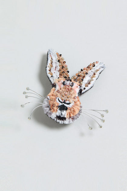 The Hand Embroidered Bunny Rabbit Brooch features a small animal head with long ears, intricate beadwork, and wire whiskers tipped with beads, presented on a plain background.