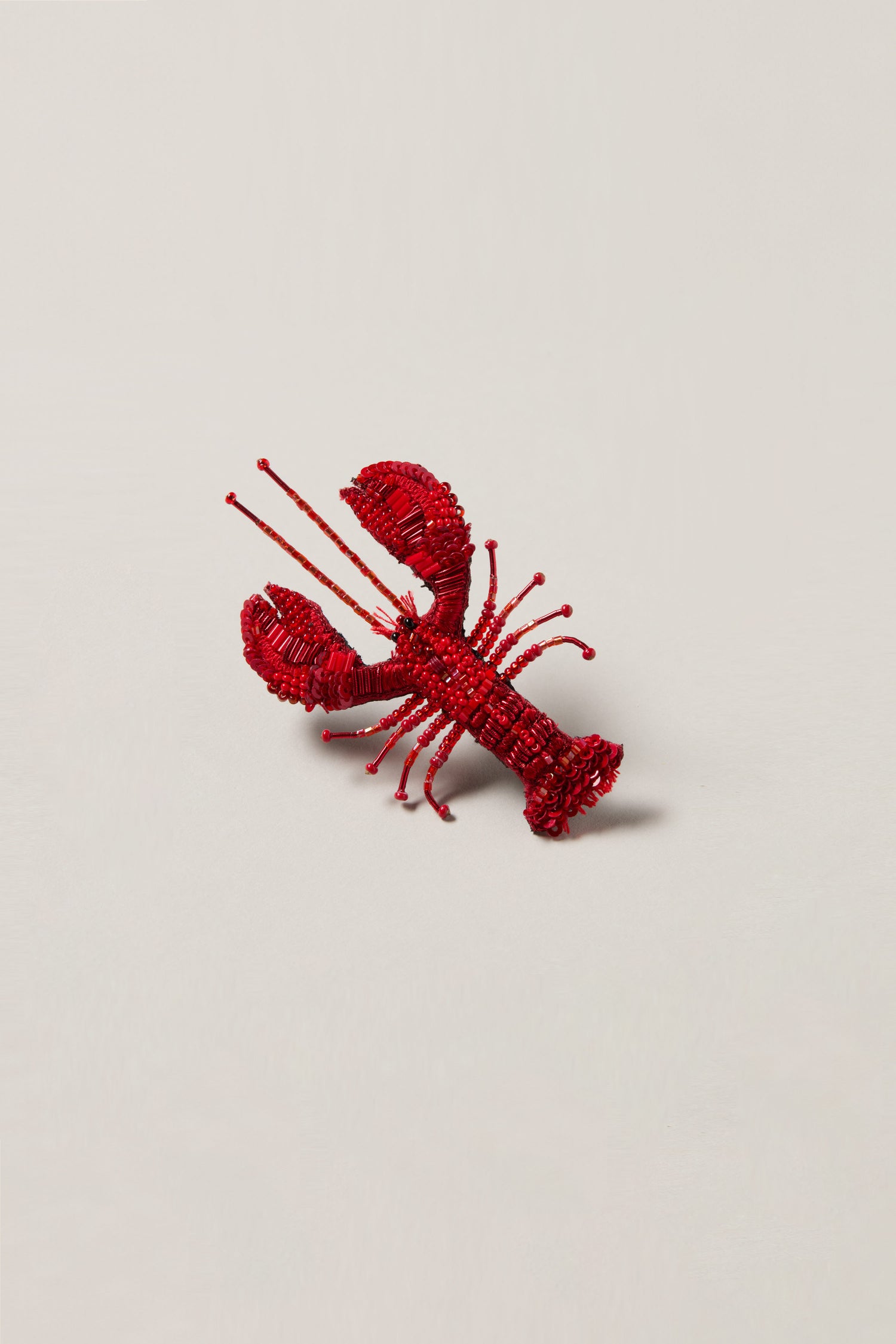 A detailed Hand Embroidered Lobster Brooch with sequin and beaded embellishments displayed on a plain light background.