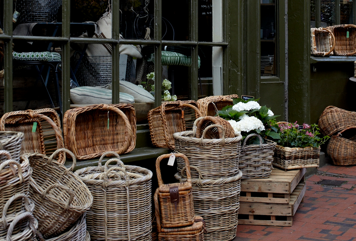 woven baskets in front of a shop