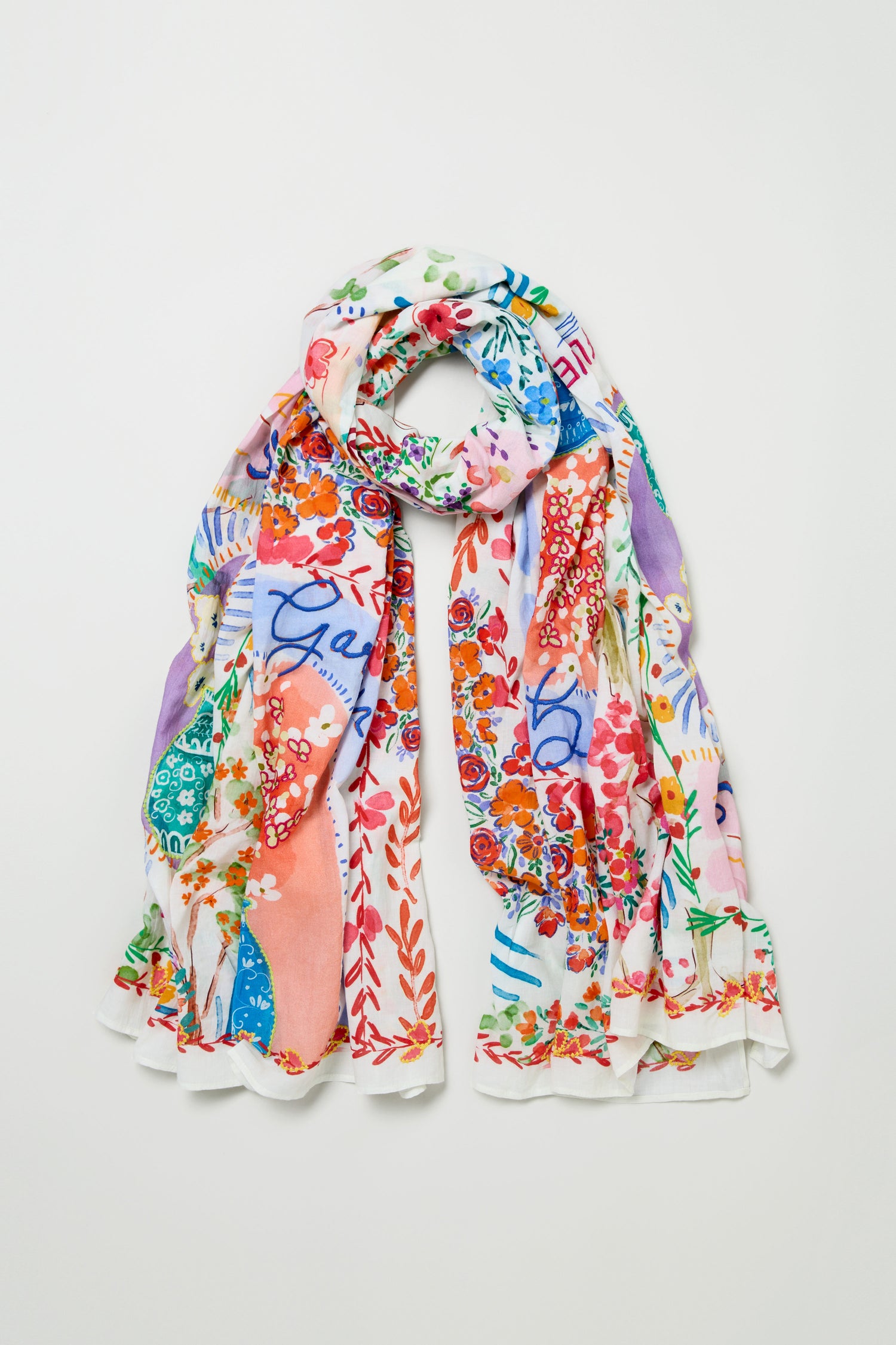 The Floral Bouquet Cotton Scarf is a lightweight cotton accessory with a colorful, abstract floral print in red, blue, green, and purple tones, shown laid flat on a white background.