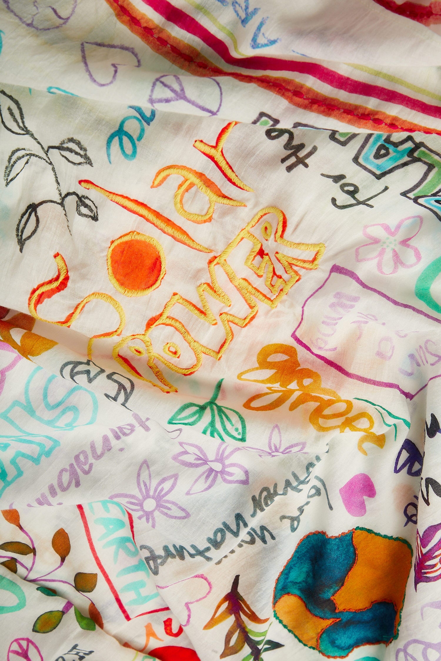 Peace Earth Love Printed Cotton Scarf with various handwritten phrases and drawings, including the word "power" prominently displayed, perfect for summer styling.