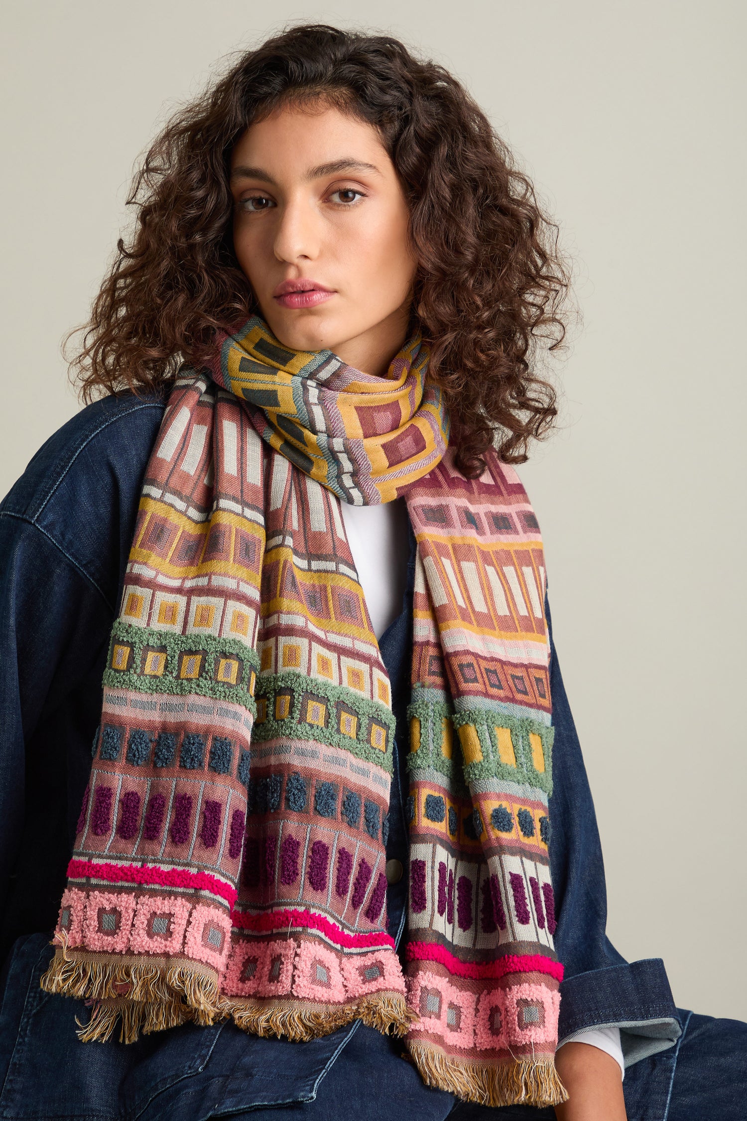 Person wearing a denim jacket and a Textured Cotton Scarf, looking at the camera with a neutral expression.