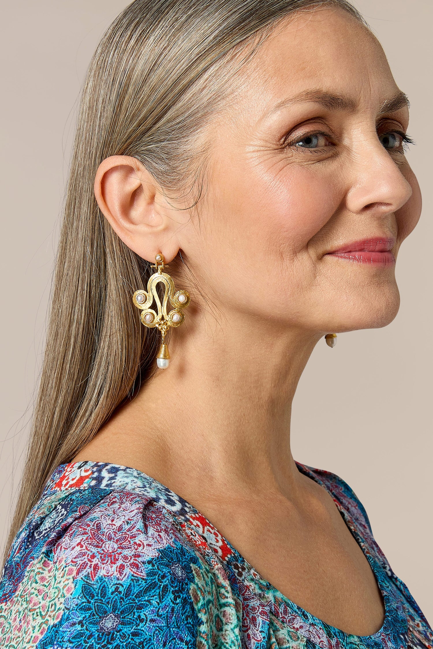 A woman wearing Handcrafted Ottoman Earrings.