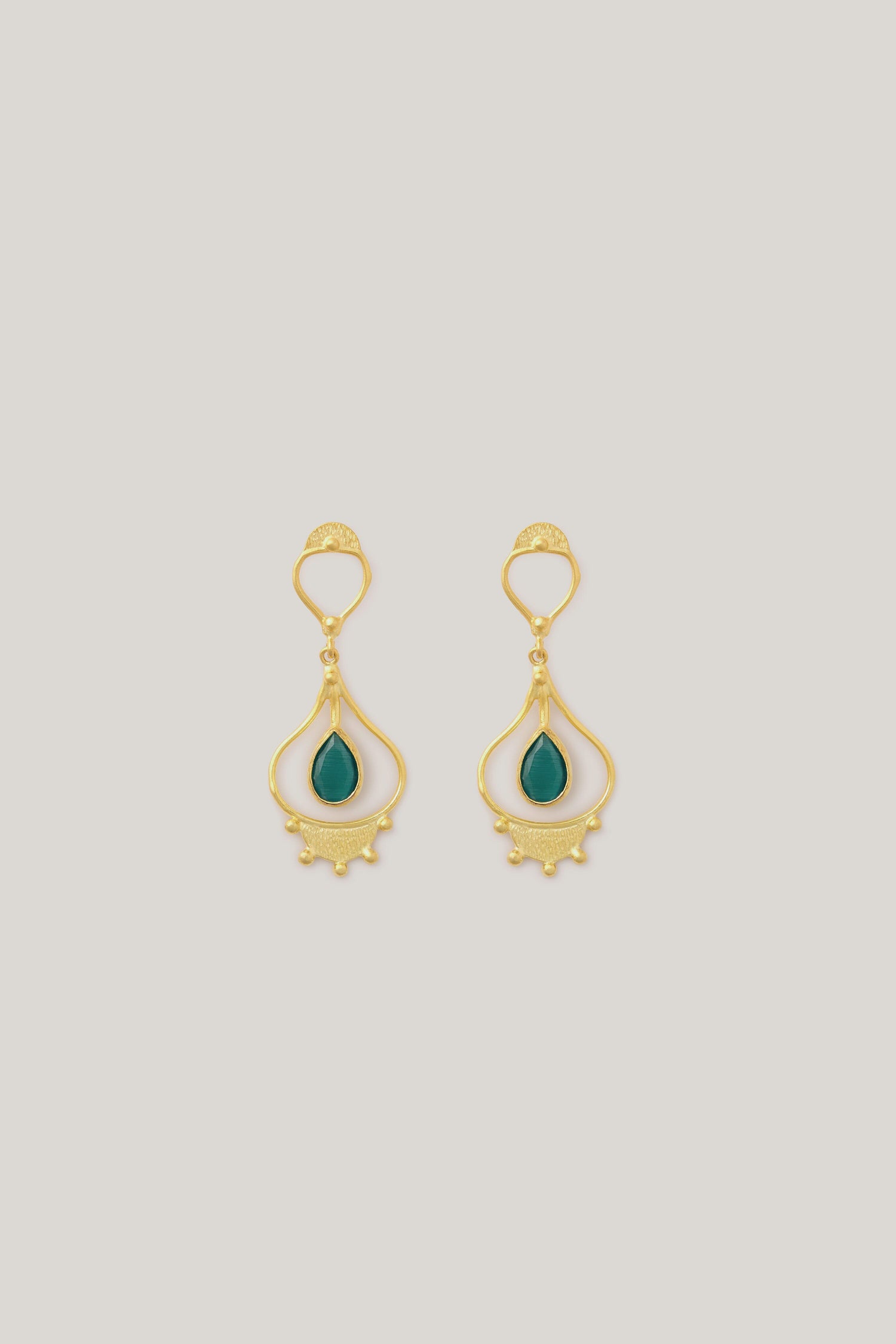 Handcrafted teardrop earrings with emerald stones.