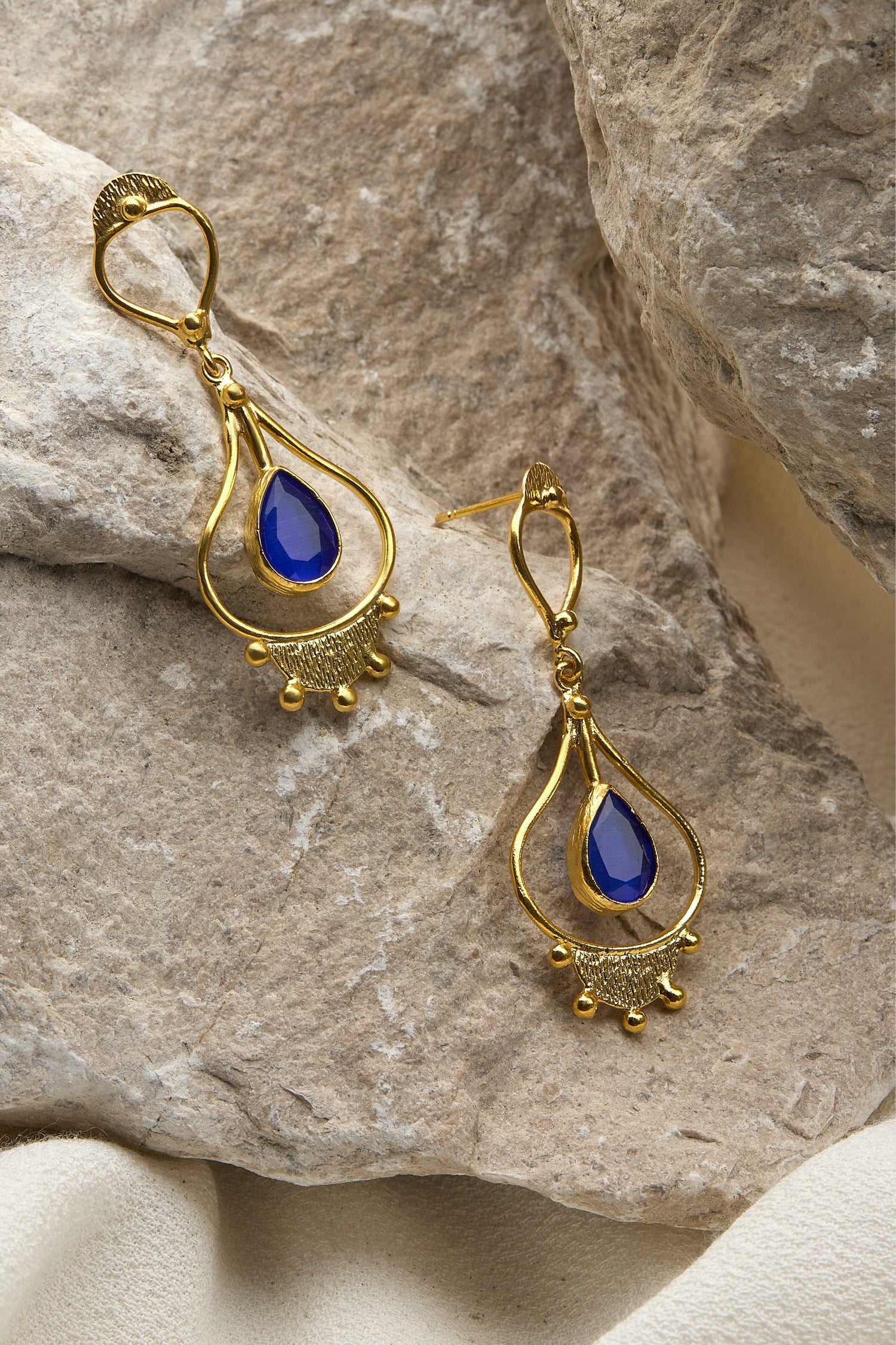 Handcrafted Teardrop Earrings with blue sapphires and gold-plating.