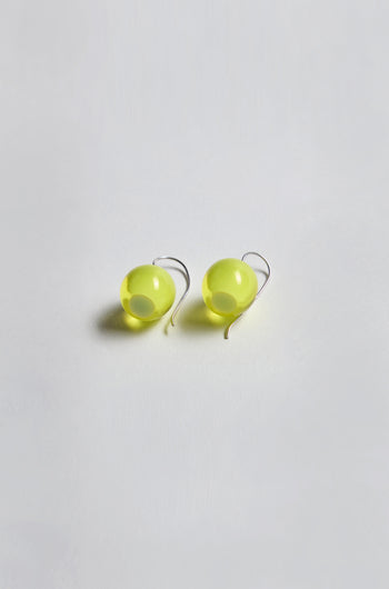 Exquisitely crafted and part of the Bellisima Collection, the Colourful Bead Earrings feature bright yellow resin beads with silver hooks, elegantly showcased on a white background.