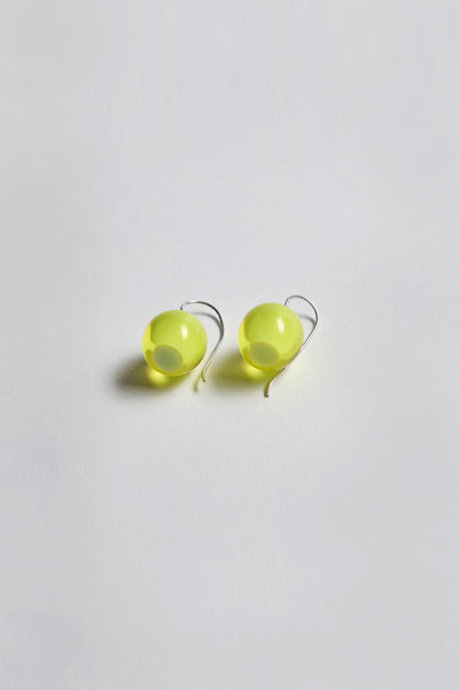 Exquisitely crafted and part of the Bellisima Collection, the Colourful Bead Earrings feature bright yellow resin beads with silver hooks, elegantly showcased on a white background.