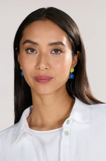 A woman with long dark hair wears a white shirt and Colourful Beads Double Sphere Earrings, looking directly at the camera.