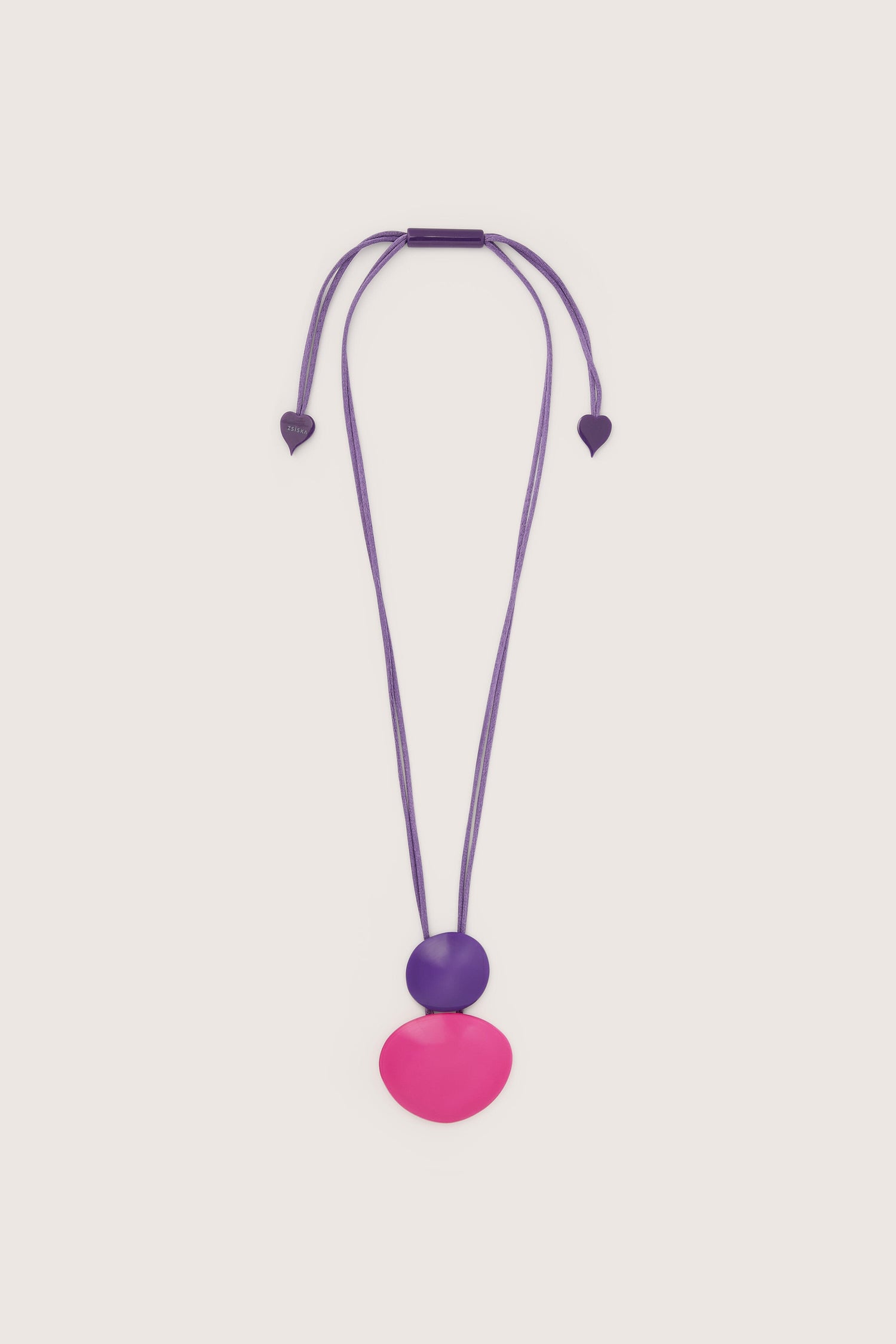 Necklace: This Resin Sphere Pendant necklace features organic shapes in purple with a pink circle and hearts, making it a unique statement piece.