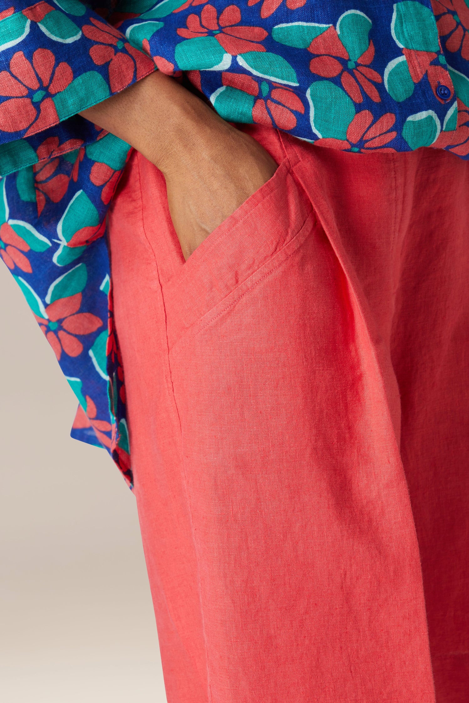 A close up of a hand in the pocket of Bradley Linen Shorts.