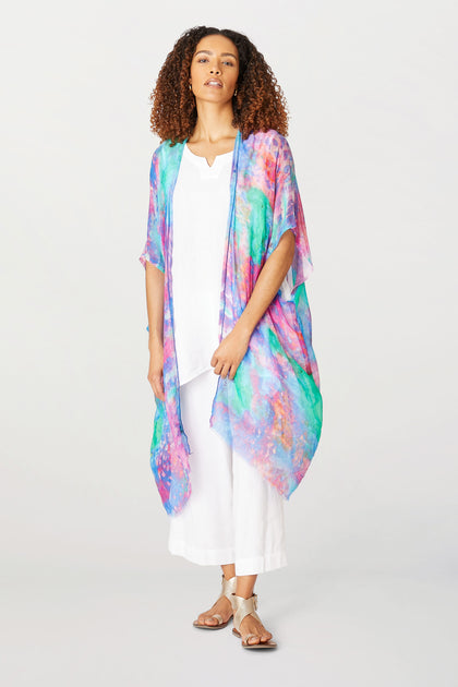 A woman wearing an Artist’s Palette Modal Kaftan and white pants.