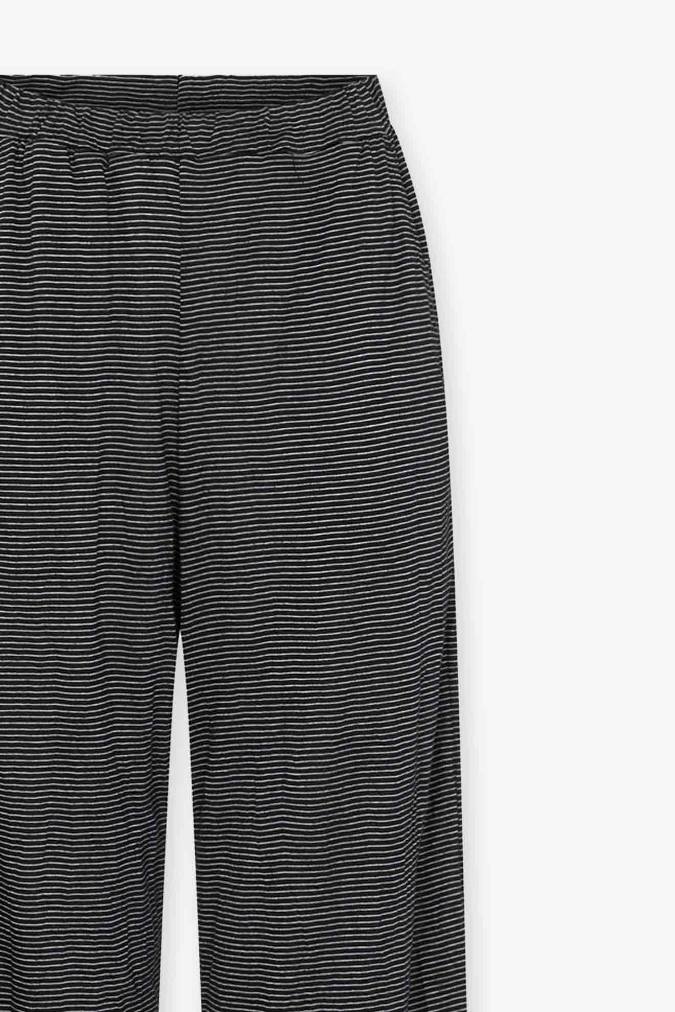 Alembika's Stripe Pant in black and white striped, crinkled jersey knit on a white background.
