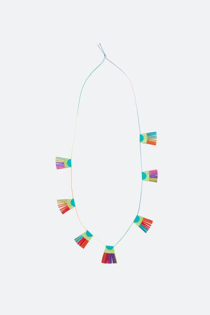 Sculpted by Alexandra Tsoukala, the Fan Detail Necklace showcases a lightweight, multi-tone fabric fan design with evenly spaced tassels on a minimalist string background.