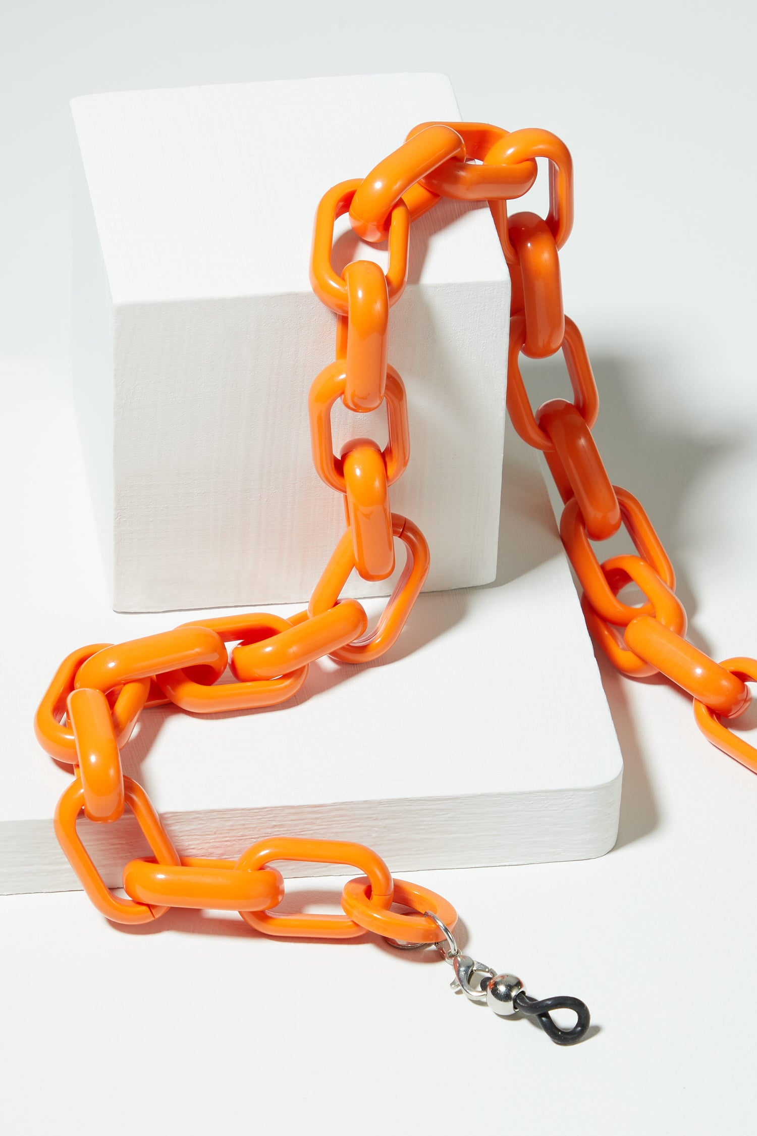 An Anima Glasses Chain on a white surface.