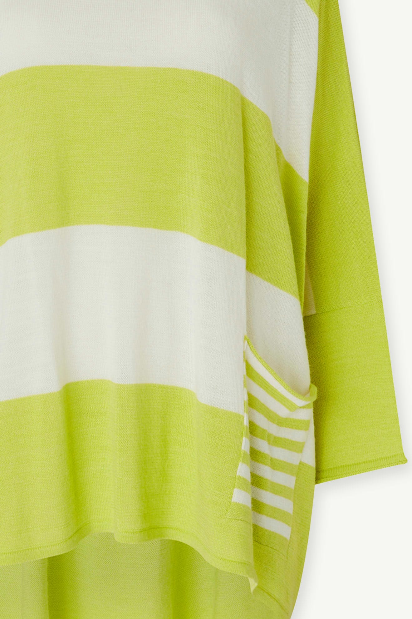 Merino Blend Stripe Sweater—this green and white striped knit features a small side pocket with narrower stripes, making it the perfect cozy yet playful piece for transitional weather.
