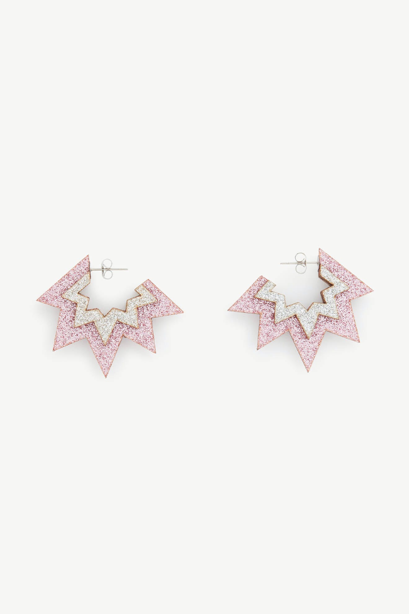 A pair of Mini Laser Cut Sparkle Hoops featuring a star-shaped design with pink glitter and a zigzag pattern, crafted from eco-friendly wood and attached with silver studs.