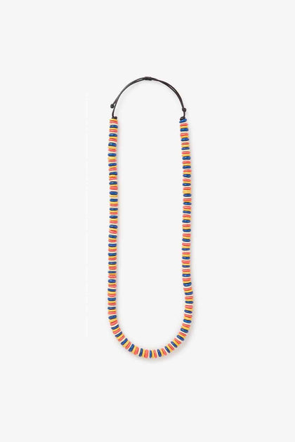The Mondrian Disc Necklace by Lotusfeet features vibrant wooden beads in a colorful design, perfect as a statement long necklace for any occasion.