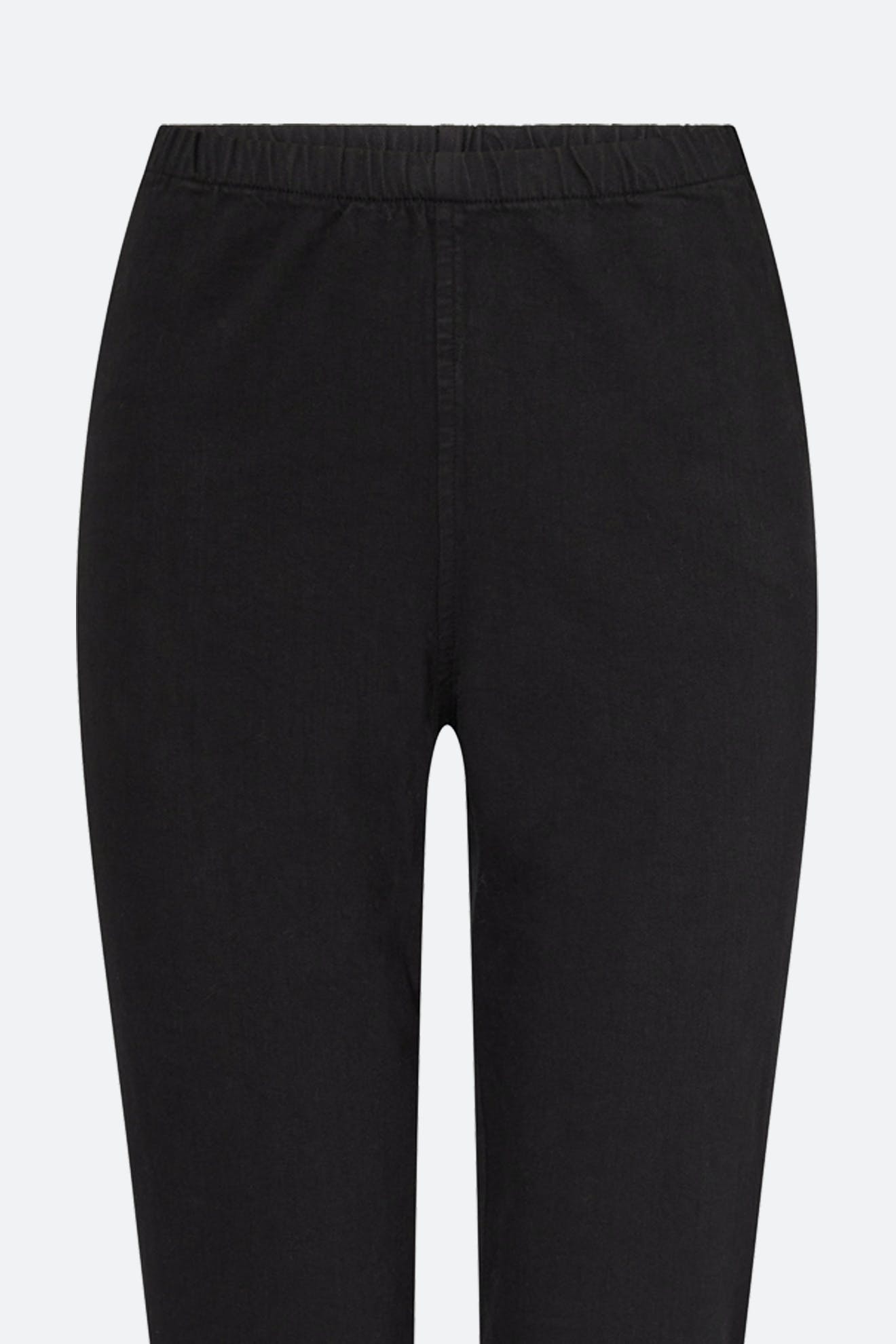 Close-up of the Stretch Cotton Twill Trouser in black, featuring a slim-leg tapered fit and an elasticated waist, shown from the front against a plain light background.