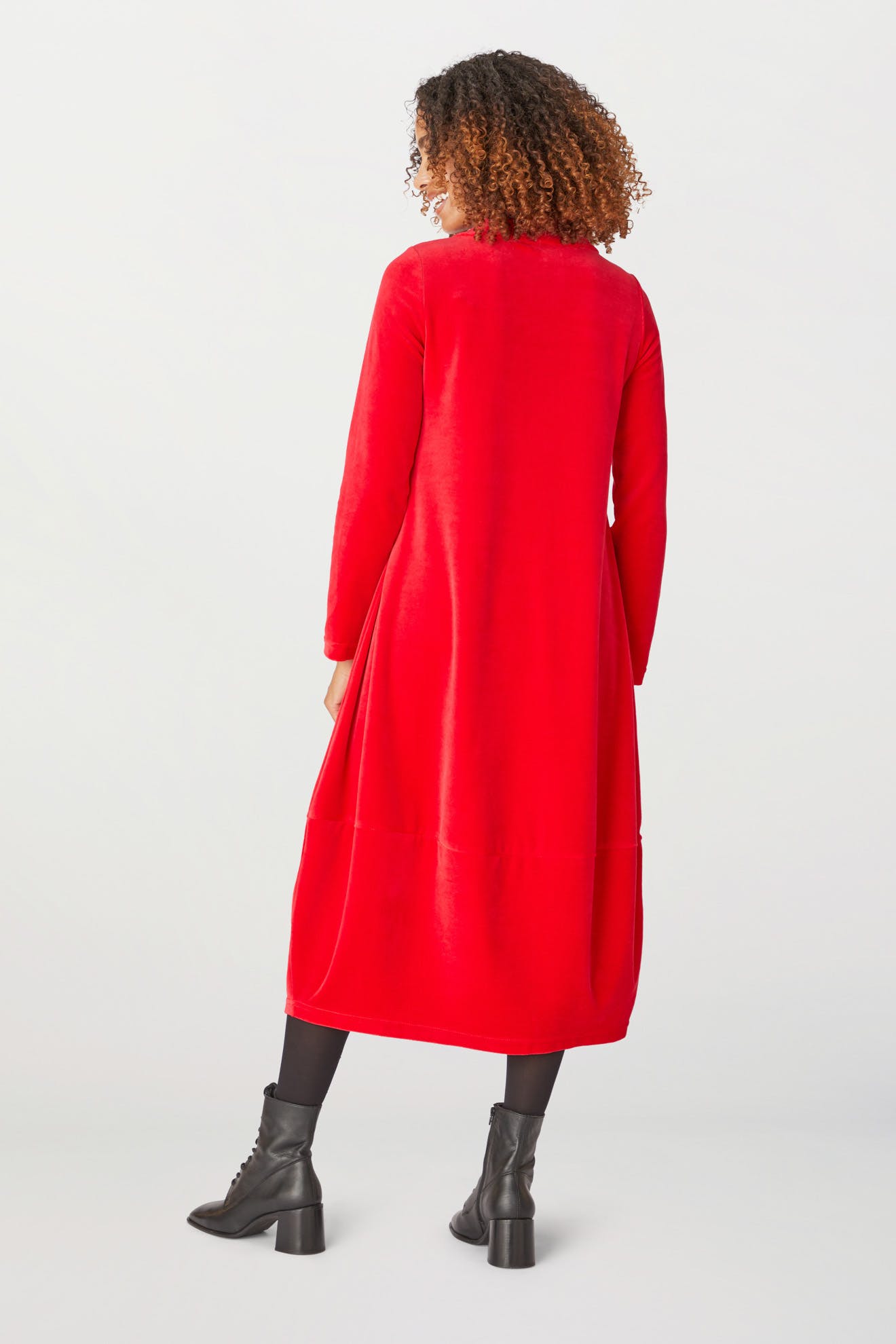 The back view of a woman wearing a Velvet Jersey Bubble Dress.