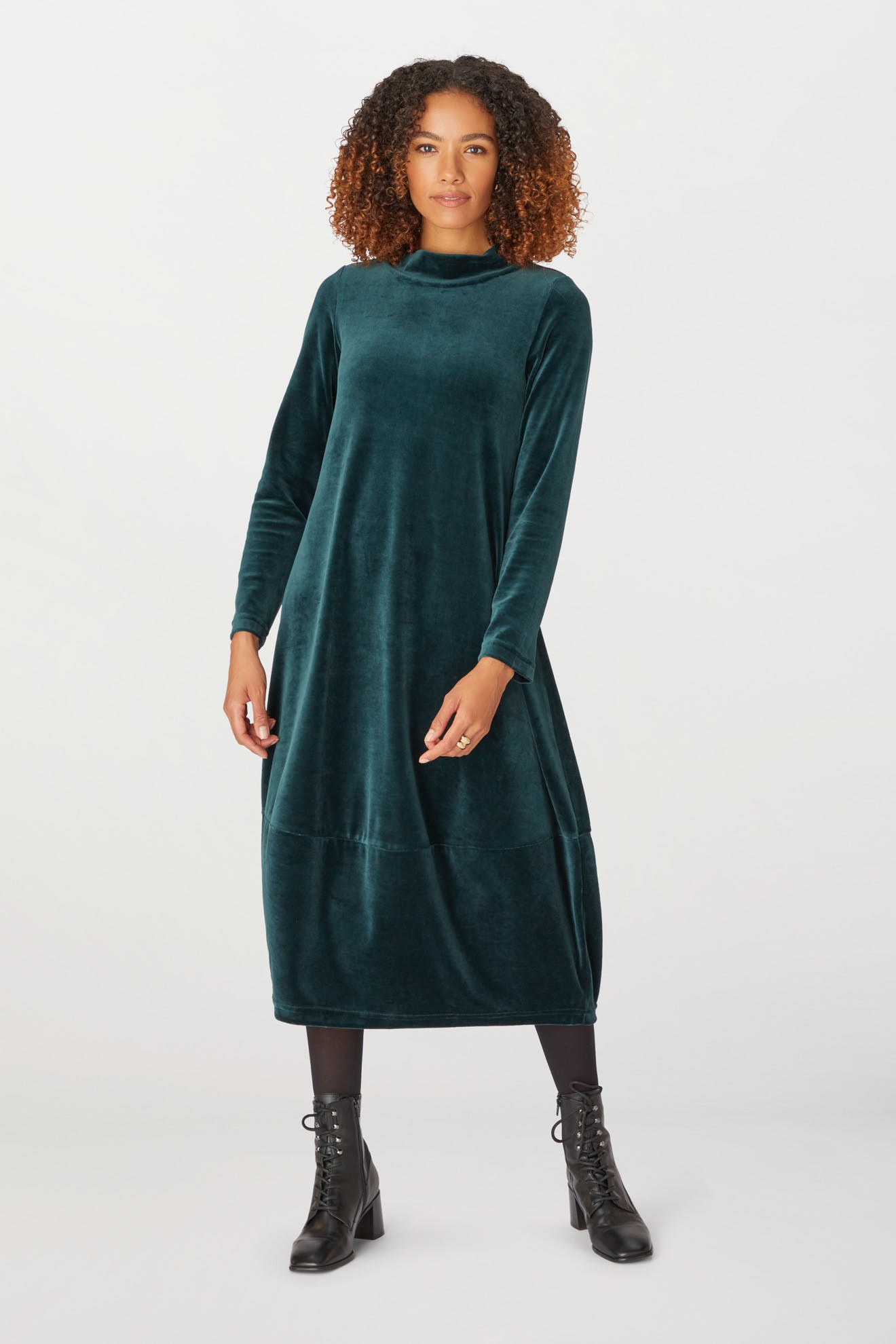The model is wearing a Velvet Jersey Bubble Dress for the holiday season.