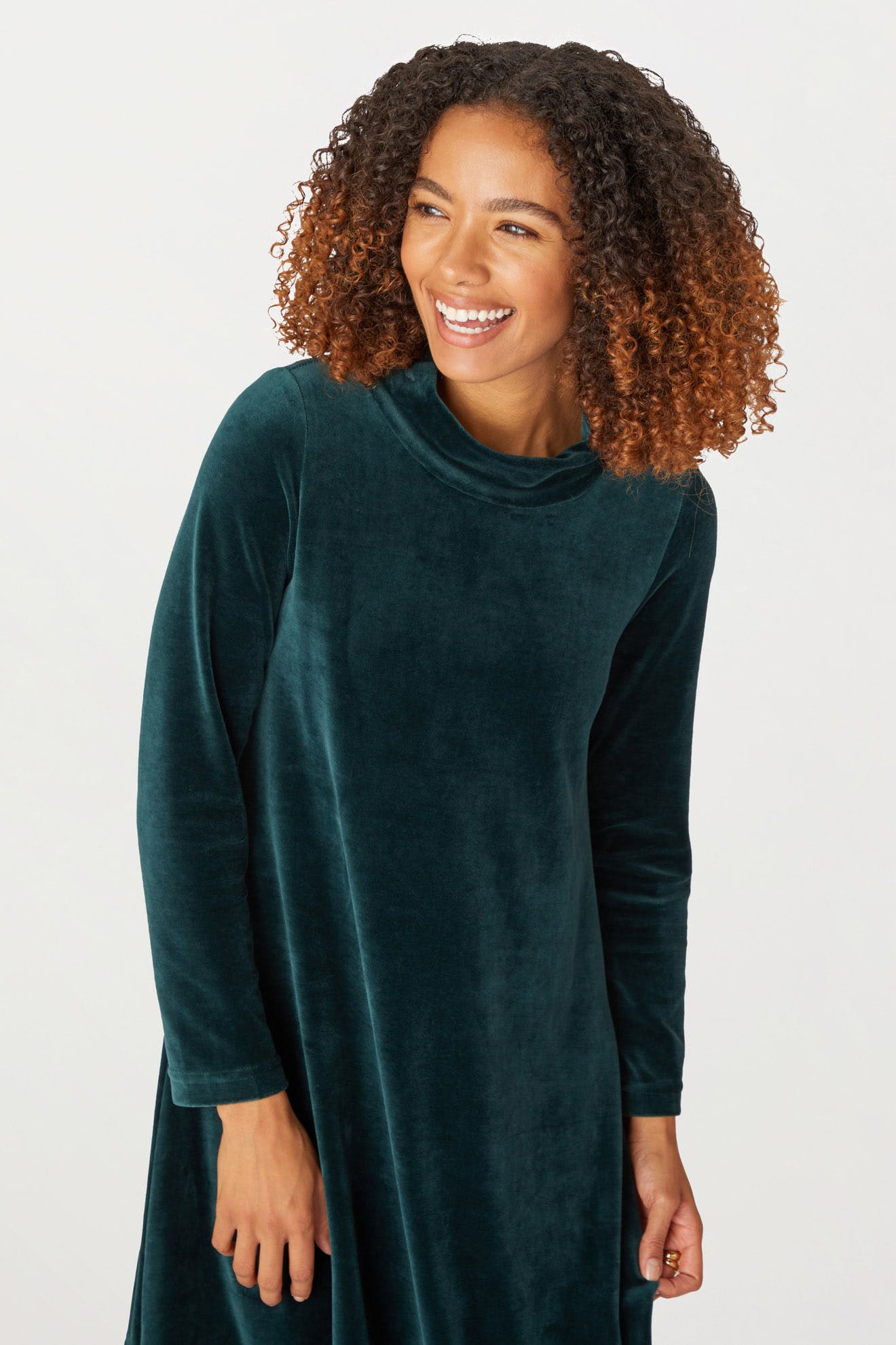 A woman wearing a Velvet Jersey Bubble Dress in the holiday season.