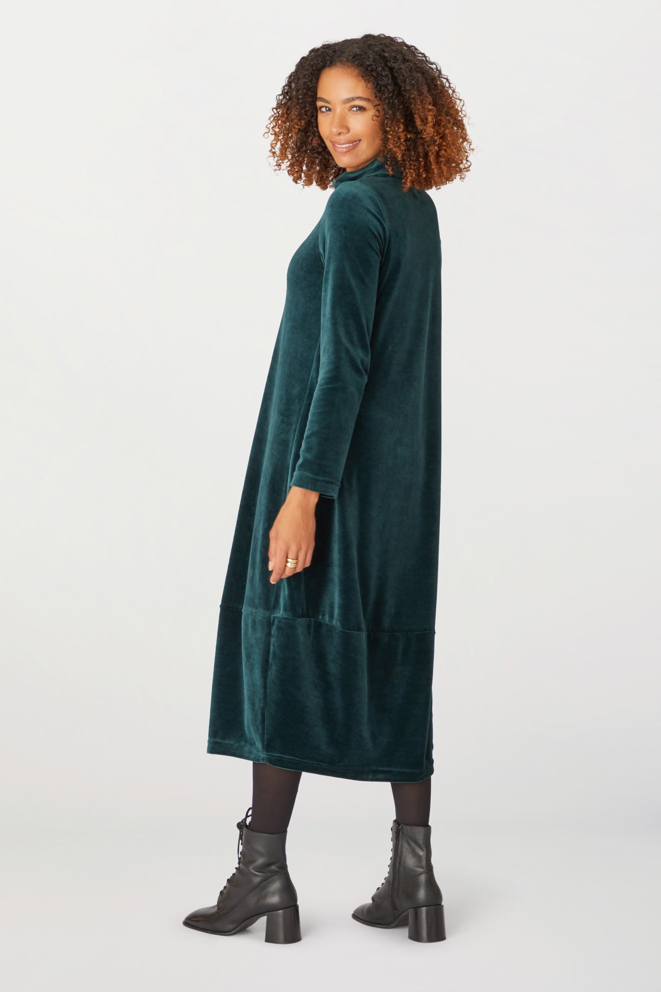 The back view of a woman wearing a Velvet Jersey Bubble Dress.