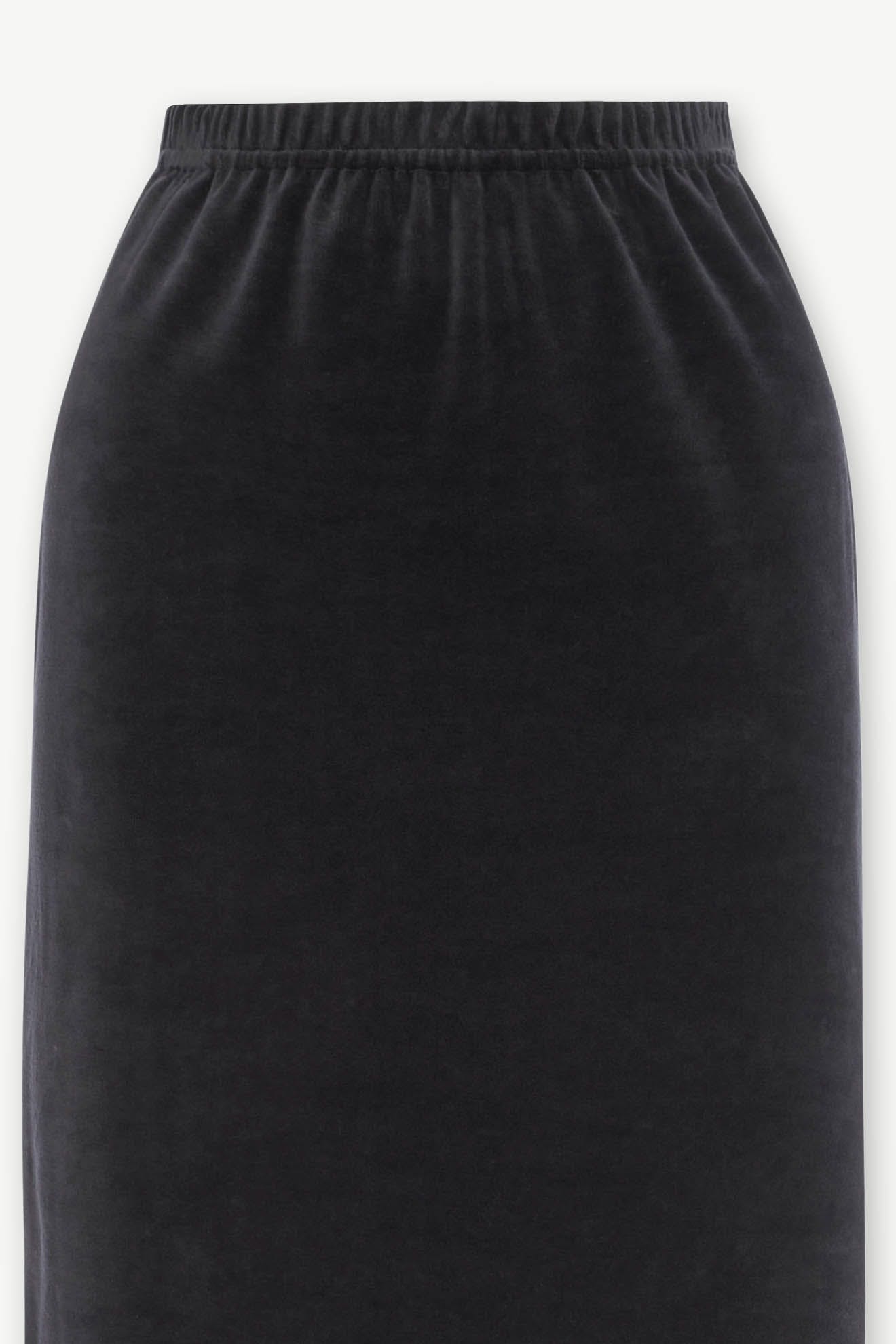 Image of a Velvet Jersey Tube Skirt in black, featuring a high-waisted design with an elastic waistband. This classic silhouette is crafted from velvet jersey material, ensuring both comfort and style.