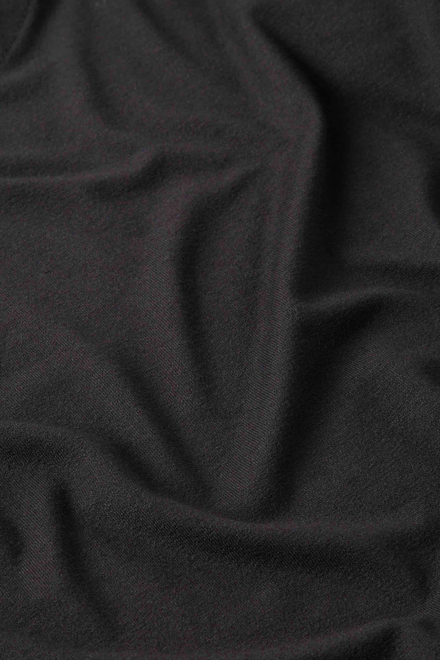A close up image of a Jersey Easy Top - a soft black fabric.