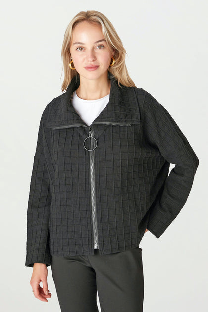 A person wearing a Window Pane Wool Jacket over a white shirt stands against a plain background.